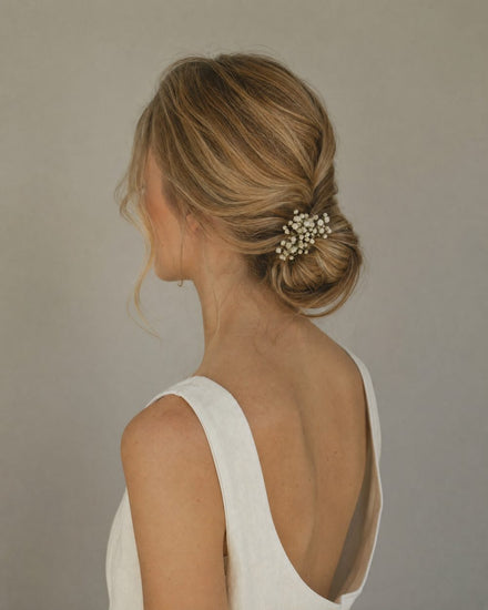 Soft low bridal bun with face-framing pieces (style illustration)